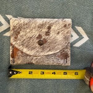 Acid wash cowhide pouch